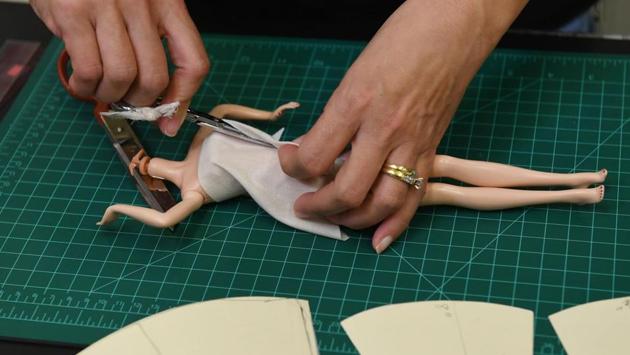 Blonde or brunette, slender or curvy, black or white, princess or president, Barbie is a forever favorite for young girls and is being used to empower them now. (Photo by Mark RALSTON / AFP) (AFP)