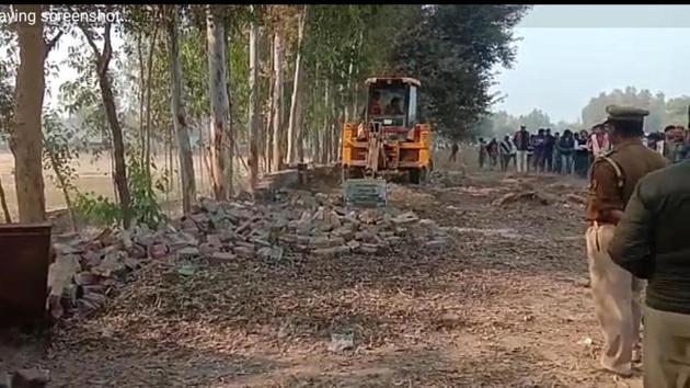 District administration razing the college boundary wall after the protestors turned violent (Sourced) District administration razing the college boundary wall after the protestors turned violent (Sourced)