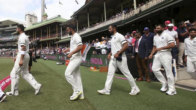 Virat Kohli, second left, leads his team out for a ceremony before their cricket test match against Australia in Sydney.(AP)
