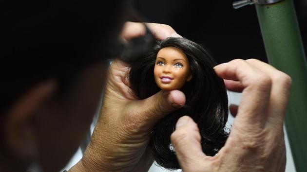 Barbie is not only a toy store success -- she has a massive social media presence, and is something of an “influencer,” with millions of followers. Barbie has a hair stylist, makeup artist and photographer who travel with her “for real” in the United States and abroad for Instagram photo sessions. Her account has nearly two million followers. (Mark Ralston / AFP) Barbie is not only a toy store success -- she has a massive social media presence, and is something of an “influencer,” with millions of followers. Barbie has a hair stylist, makeup artist and photographer who travel with her “for real” in the United States and abroad for Instagram photo sessions. Her account has nearly two million followers. (Mark Ralston / AFP)