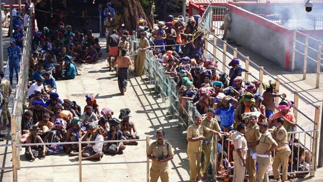 Hindu devotees wait in line to visit the Sabarimala temple in Kerala following the entry of two women on January 2.(AFP Photo)