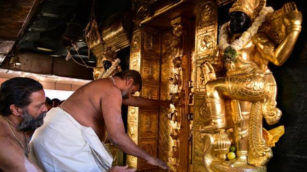 A priest closes the doors of sanctum sanctorum for performing religious rituals following the entry of two women in Sabarimala temple which traditionally bans the entry of women of menstrual age, in Pathanamthitta on January 2.(REUTERS)