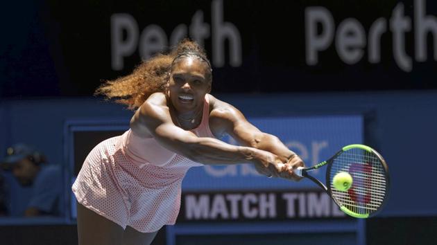 Serena Williams returns the ball during her match against Katie Boulter in the Hopman Cup in Perth.(AP)