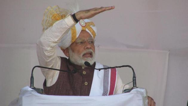 Prime Minister Narendra Modi addressing a public meeting after the inauguration and laying of foundations stones using a remote controlled device at the Hapta Kangjeibung in Imphal. (HT PHOTO) Prime Minister Narendra Modi addressing a public meeting after the inauguration and laying of foundations stones using a remote controlled device at the Hapta Kangjeibung in Imphal. (HT PHOTO)