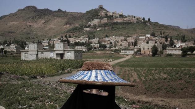 A woman walks through Ibb, Yemen. (Nariman El-Mofty / AP) A woman walks through Ibb, Yemen. (Nariman El-Mofty / AP)