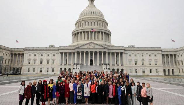 Speaker Nancy Pelosi (D-CA) (C front row) poses for photographs with all of her fellow House Democratic women in front of the U.S. Capitol in Washington, DC on Friday.(AFP)