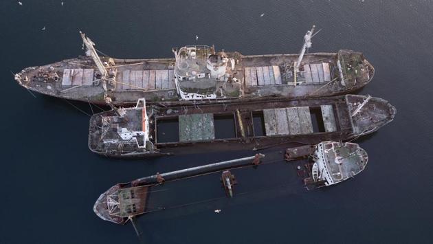 These are just a few of dozens of abandoned cargo and passenger ships that lie semi-submerged or completely sunken in and near the Gulf of Elefsina, an industrial area of shipyards and factories near Greece’s major port of Piraeus. (Thanassis Stavrakis / AP) These are just a few of dozens of abandoned cargo and passenger ships that lie semi-submerged or completely sunken in and near the Gulf of Elefsina, an industrial area of shipyards and factories near Greece’s major port of Piraeus. (Thanassis Stavrakis / AP)