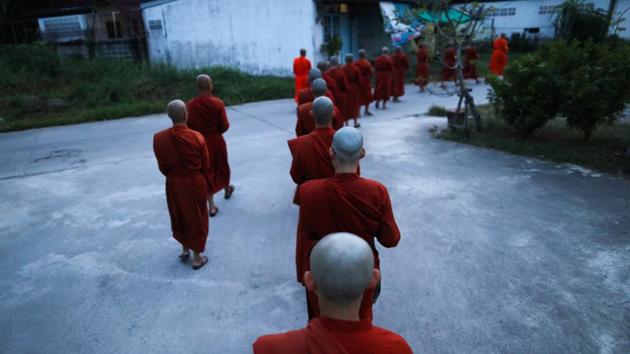 Novice monks walk in line to receive food offerings from people at the Songdhammakalyani monastery. There are about 270 female monks across Thailand and they were all ordained abroad, Dhammananda said, adding that her monastery houses seven of them. In contrast, Thailand has more than 250,000 male monks. (Athit Perawongmetha / REUTERS) Novice monks walk in line to receive food offerings from people at the Songdhammakalyani monastery. There are about 270 female monks across Thailand and they were all ordained abroad, Dhammananda said, adding that her monastery houses seven of them. In contrast, Thailand has more than 250,000 male monks. (Athit Perawongmetha / REUTERS)
