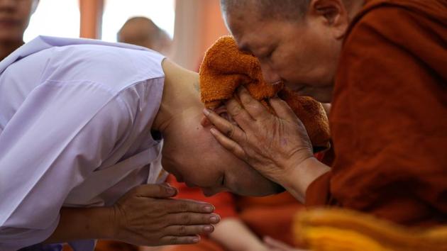 A Thai woman devotee who ended her novice monkhood has her head cleaned by Dhammananda Bhikkhuni. “It’s been 90 years and the social context has changed, but they still don’t accept us,” Dhammananda told Reuters. “It’s a shame that women aren’t allowed to make decisions for their own lives. You have to rebel against injustice because this is not right,” she added. (Athit Perawongmetha / REUTERS) A Thai woman devotee who ended her novice monkhood has her head cleaned by Dhammananda Bhikkhuni. “It’s been 90 years and the social context has changed, but they still don’t accept us,” Dhammananda told Reuters. “It’s a shame that women aren’t allowed to make decisions for their own lives. You have to rebel against injustice because this is not right,” she added. (Athit Perawongmetha / REUTERS)