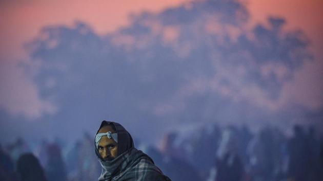 A man taking part in the 201st anniversary commemorations of the Battle of Koregaon, covers himself with warm clothes on in Koregaon Bhima in Pune, Maharashtra. (Pratham Gokhale / HT Photo) A man taking part in the 201st anniversary commemorations of the Battle of Koregaon, covers himself with warm clothes on in Koregaon Bhima in Pune, Maharashtra. (Pratham Gokhale / HT Photo)