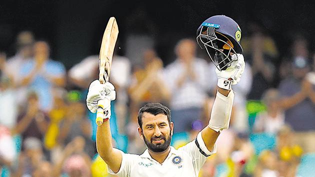 Cheteshwar Pujara celebrates his century on the first day of the fourth Test against Australia. When Rahul Dravid retired, Pujara was considered the perfect replacement. But the comparison has not always worked for the younger player.(AFP)