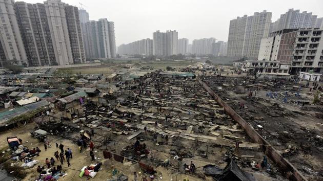 A view of burnt shanties in a slum dwelling at Sarfabad village, in Sector 73, Noida, Uttar Pradesh. Over 250 houses were charred and 1000 men, women and children left shelterless in a fire that struck the slum. (Virendra Singh Gosain / HT Photo) A view of burnt shanties in a slum dwelling at Sarfabad village, in Sector 73, Noida, Uttar Pradesh. Over 250 houses were charred and 1000 men, women and children left shelterless in a fire that struck the slum. (Virendra Singh Gosain / HT Photo)