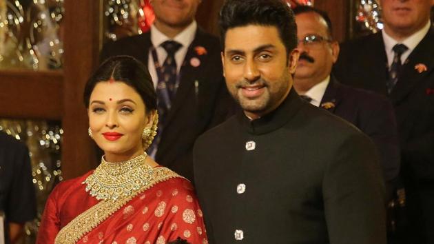 Actor Abhishek Bachchan, his wife actor Aishwarya Rai arrive to attend the wedding ceremony of Isha Ambani.(REUTERS)