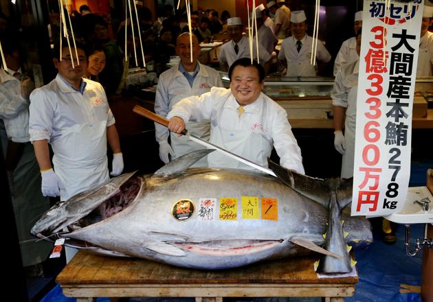 President of sushi restaurant chain Sushi-Zanmai, Kiyoshi Kimura (C), displays a 278kg bluefin tuna at his main restaurant in Tokyo, Japan. A record $3.1 million was paid for a giant tuna on January 5 as Tokyo's new fish market, which replaced the world-famous Tsukiji late last year, held its first pre-dawn New Year’s auction. (Kim Kyung-Hoon / REUTERS) President of sushi restaurant chain Sushi-Zanmai, Kiyoshi Kimura (C), displays a 278kg bluefin tuna at his main restaurant in Tokyo, Japan. A record $3.1 million was paid for a giant tuna on January 5 as Tokyo's new fish market, which replaced the world-famous Tsukiji late last year, held its first pre-dawn New Year’s auction. (Kim Kyung-Hoon / REUTERS)