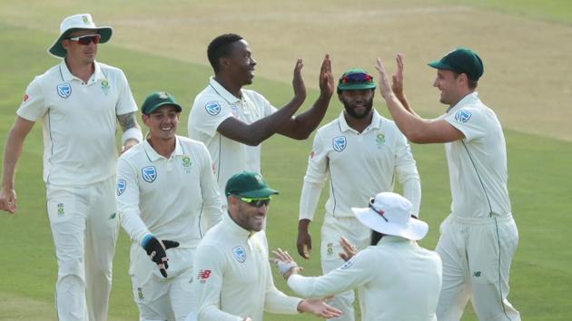 South Africa's Kagiso Rabada celebrates with team mates after taking the wicket of Pakistan's Babar Azam.(REUTERS)