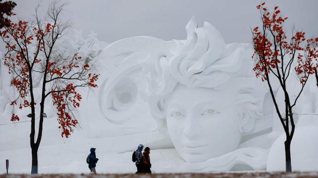 People walk past a snow sculpture in Harbin in China’s northeastern Heilongjiang province. (AFP) People walk past a snow sculpture in Harbin in China’s northeastern Heilongjiang province. (AFP)