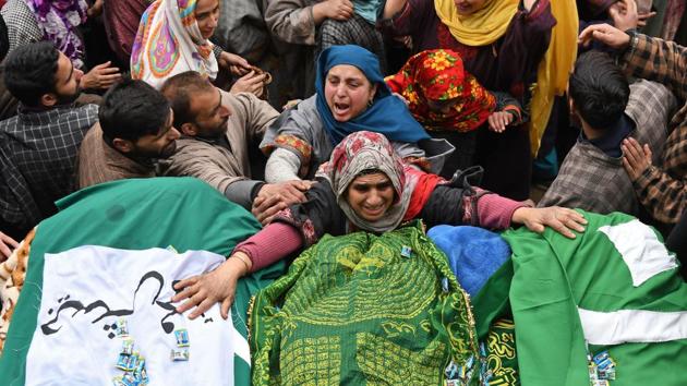 A Kashmiri woman touches the feet of two slain militants during a funeral procession in Chursoo Awantipora, in Pulwama district south of Srinagar, Jammu and Kashmir. (Tauseef Mustafa / AFP) A Kashmiri woman touches the feet of two slain militants during a funeral procession in Chursoo Awantipora, in Pulwama district south of Srinagar, Jammu and Kashmir. (Tauseef Mustafa / AFP)