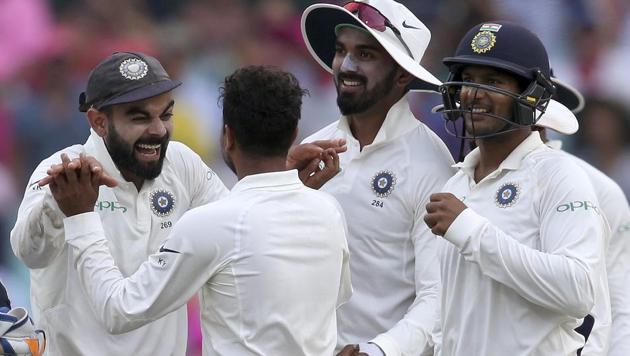 India vs Australia: Kohli, left, celebrates with India's Kuldeep Yadav after the wicket of Australia's Travis Head on day 3 of their cricket test match in Sydney, Saturday, Jan. 5, 2019(AP)