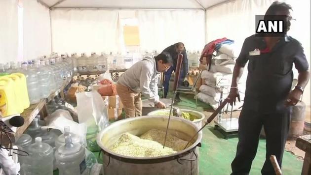 the BJP will be cooking over 3,000 kg khichdi with rice and lentils collected from nearly three lakh Dalit households in Delhi at its rally in New Delhi on Sunday.(ANI Photo)