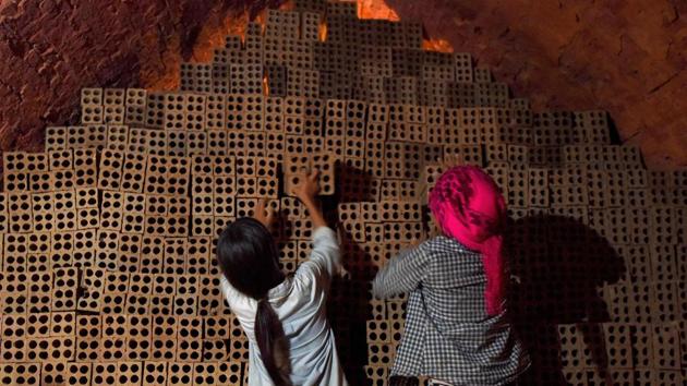Women working at a brick factory. Image for representation. (AFP file photo) Women working at a brick factory. Image for representation. (AFP file photo)