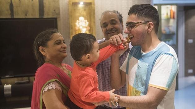 Jagesh Golwala celebrates his success with his family at his house at Parel in Mumbai, India, on Saturday (Pratik Chorge/HT Photo) Jagesh Golwala celebrates his success with his family at his house at Parel in Mumbai, India, on Saturday (Pratik Chorge/HT Photo)