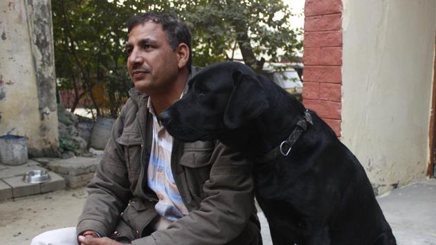 Head constable Rishi Raj seen with a police dog at Sadar police station, in Gurugram (Yogendra Kumar/HT PHOTO) Head constable Rishi Raj seen with a police dog at Sadar police station, in Gurugram (Yogendra Kumar/HT PHOTO)
