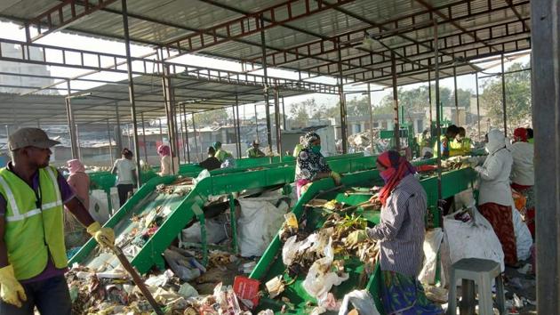 Garbage being segregated at the first commissioned plant which has a capacity of 16 tonnes.(HT Photo)