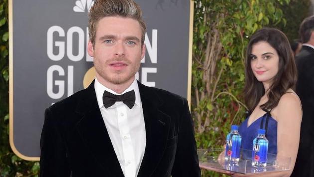 Twitter has been buzzing with pictures of “water girl” photobombing stars on the Golden Globes red carpet. (Twitter) Twitter has been buzzing with pictures of “water girl” photobombing stars on the Golden Globes red carpet. (Twitter)