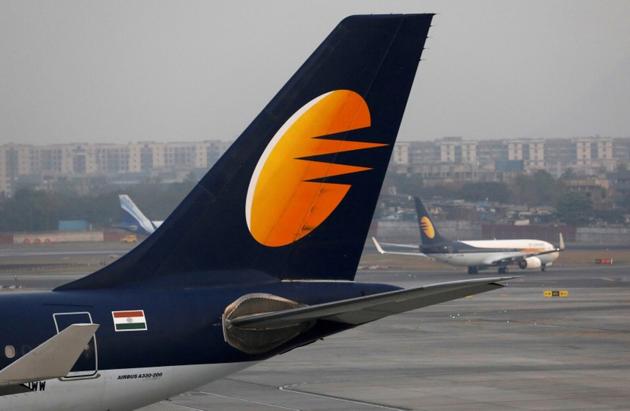 A Jet Airways plane is parked as another moves to runway at the Chhatrapati Shivaji International airport in Mumbai on February 14, 2018. (REUTERS) A Jet Airways plane is parked as another moves to runway at the Chhatrapati Shivaji International airport in Mumbai on February 14, 2018. (REUTERS)