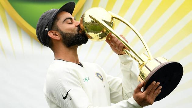 India's captain Virat Kohli kisses the Border-Gavaskar Trophy as they celebrate a 2-1 series victory over Australia following play being abandoned in the fourth test match between Australia and India at the SCG in Sydney, Australia, January 7, 2019.(REUTERS)
