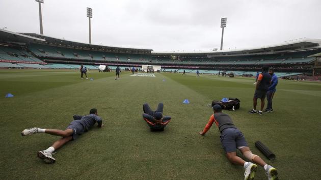 Members of the Indian cricket warm up before play on day 5 of their Test match against Australia in Sydney.(AP)