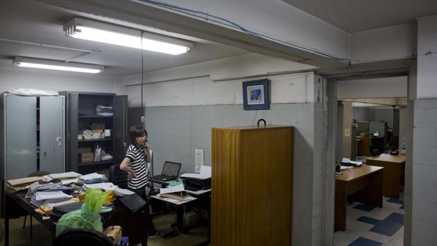 Nabuko Kojo, administrative director of the Sao Paulo Shimbun answers the phone as she empties her desk. The arrival of the first immigrants followed negotiations between Japan and Sao Paulo, where most Japanese-Brazilians still live. Japan needed an escape valve for poor farmers, left out of the country’s rapid modernization. Meanwhile, Sao Paulo needed more workers to tend to its coffee plantations. (Victor R. Caivano / AP) Nabuko Kojo, administrative director of the Sao Paulo Shimbun answers the phone as she empties her desk. The arrival of the first immigrants followed negotiations between Japan and Sao Paulo, where most Japanese-Brazilians still live. Japan needed an escape valve for poor farmers, left out of the country’s rapid modernization. Meanwhile, Sao Paulo needed more workers to tend to its coffee plantations. (Victor R. Caivano / AP)