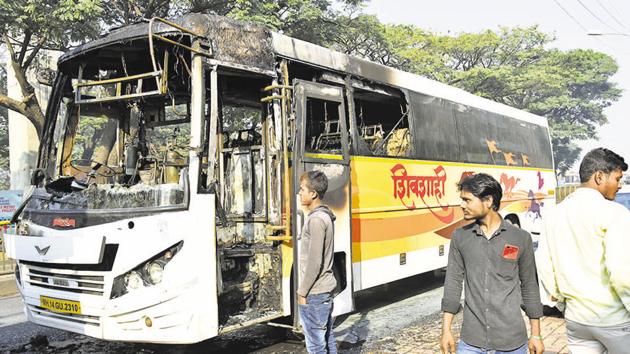 A MSRTC bus caught fire on the road leading to Golden Timber Mart in Kundannagar, near Kasarwadi on Pune-Mumbai road, on Sunday.(HT PHOTO)