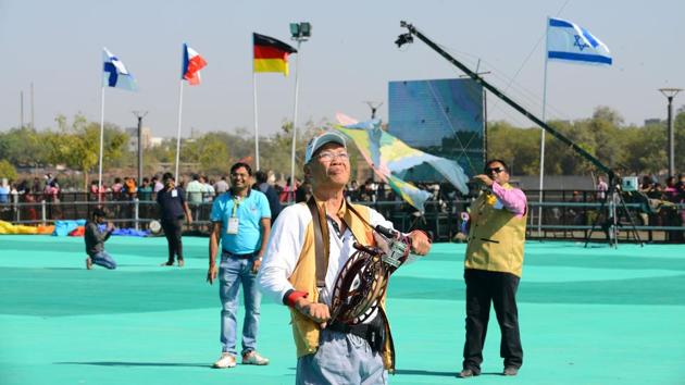 People fly kites as they participate in the festival. Nationals of 45 countries and people from 13 states within the country are taking part in the kite festival this year. (Sam Panthaky / AFP) 