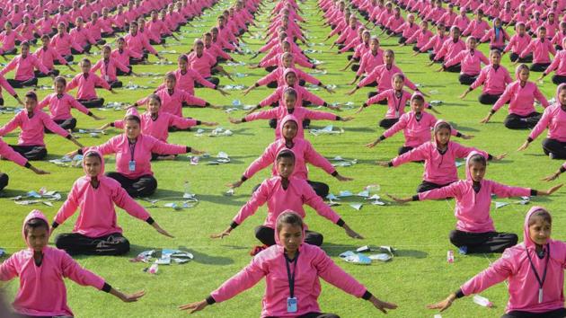 School children perform yoga during the inauguration ceremony of the festival. Organised to mark the approaching end of winter on Makar Sankranti --as the sun leaves the month of the winter solstice-- kite-enthusiasts throng to the city’s markets the night prior to purchase supplies for fierce mid-air competitions. (Sam Panthaky / AFP) 