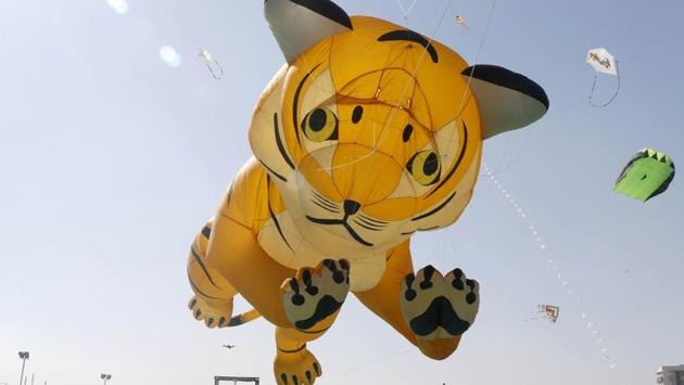 A tiger shaped kite takes over the sky after the inauguration. This year, the Gujarat government has also decided to organise a kite festival at Kevadia, the site of the Statue of Unity, a memorial to Sardar Patel and the also the world’s tallest statue. (Siddharaj Solanki / HT Photo) 