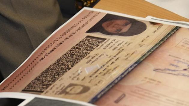 A passport copy of Rahaf Mohammed Alqunun sits on the desk as Chief of Immigration Police Maj. Gen. Surachate Hakparn talks to media about her status during a press conference at the Suvarnabhumi Airport in Bangkok on January 7.(AP Photo)