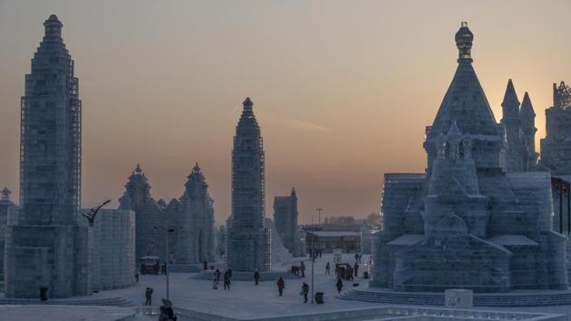 Visitors look at ice sculptures during the annual Harbin Ice and Snow Festival in Harbin, China. Swimming enthusiast Yu Hongtao, 50, had trained for months in the freezing water of the Songhua river to compete in the winter ice swimming tournament held annually in Harbin, known for its bitterly cold weather. (Fred Dufour / AFP) Visitors look at ice sculptures during the annual Harbin Ice and Snow Festival in Harbin, China. Swimming enthusiast Yu Hongtao, 50, had trained for months in the freezing water of the Songhua river to compete in the winter ice swimming tournament held annually in Harbin, known for its bitterly cold weather. (Fred Dufour / AFP)