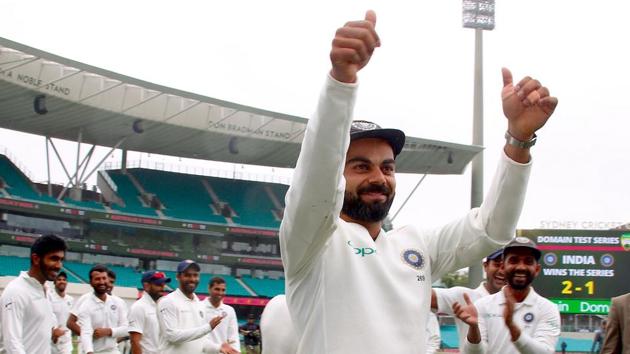 India's captain Virat Kohli (C) celebrates with teammates after winning the Test series between India and Australia at the Sydney Cricket Ground on January 7, 2019(AFP)