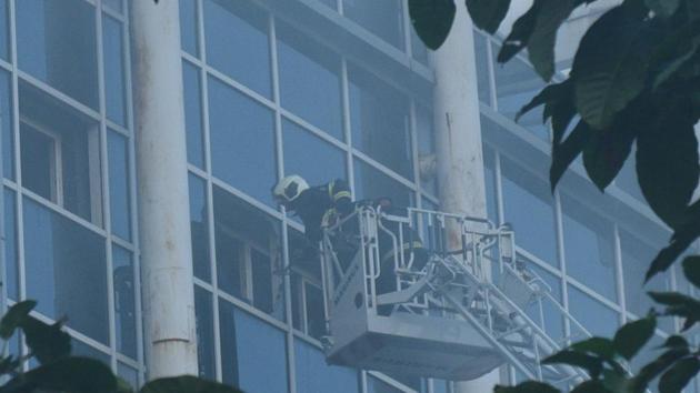 A fire fighter at work at ESIC hospital in Andheri, Mumbai, after a fire there on December 17, 2018.(HT FILE)