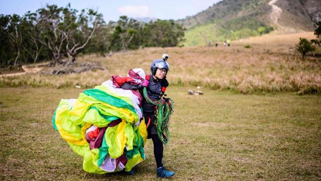 Lam, 44, first tried it in Bali and has leaped off mountainsides across Asia. But his favourite destination is still Hong Kong. He rates it “five-stars” for difficulty with fast-changing tropical weather and small landing zones, making it both a challenging and unforgiving place. The sport is not without its dangers. (Anthony Wallace / AFP) Lam, 44, first tried it in Bali and has leaped off mountainsides across Asia. But his favourite destination is still Hong Kong. He rates it “five-stars” for difficulty with fast-changing tropical weather and small landing zones, making it both a challenging and unforgiving place. The sport is not without its dangers. (Anthony Wallace / AFP)