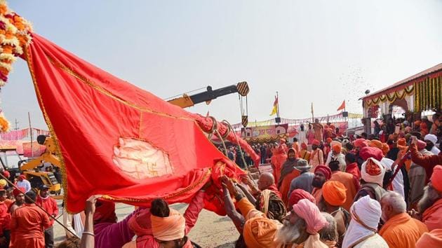 Sadhus participate in flag-hoisting ceremony ahead of Kumbh Mela 2019, in Allahabad on January 8.(PTI Photo)