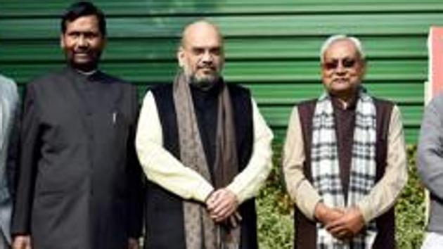 BJP President Amit Shah flanked by JD(U) Chief and Bihar Chief Minister Nitish Kumar (2nd R), Union minister and LJP President Ram Vilas Paswan (2nd L). (PTI) BJP President Amit Shah flanked by JD(U) Chief and Bihar Chief Minister Nitish Kumar (2nd R), Union minister and LJP President Ram Vilas Paswan (2nd L). (PTI)