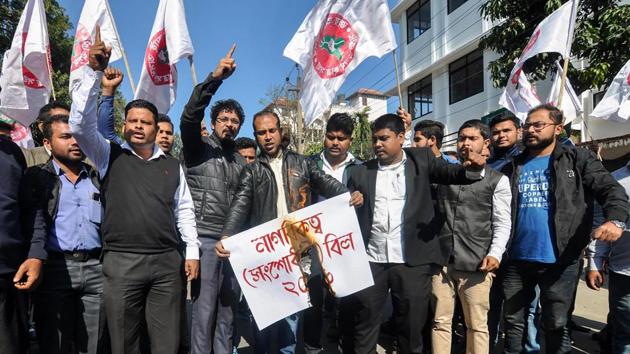 All Assam Students Union (AASU) activists hold placards as they raise slogans protesting against Citizenship (Amendment) Bill, 2016, in Guwahati on January 7.(PTI Photo)