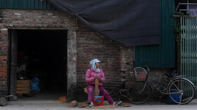 A woman carefully handpicks bamboo sticks for dying at an incense workshop. The work offers more than just pride for many in Quang Phu Cau: like Hoa, many earn good money making incense compared to factory work nearby. (Manan Vatsyayana / AFP) A woman carefully handpicks bamboo sticks for dying at an incense workshop. The work offers more than just pride for many in Quang Phu Cau: like Hoa, many earn good money making incense compared to factory work nearby. (Manan Vatsyayana / AFP)