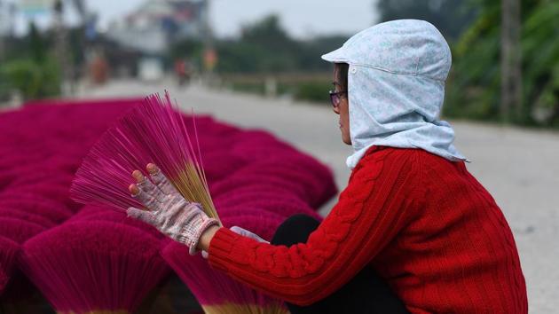 “This job is hard work, but I am earning enough to raise two of my children to become doctors,” said Le Thi Lieu as she laid her incense out to dry. That said, she’s happy her two other kids have decided to work with her. “We need at least one to work in the business so they can take over in the future.” (Manan Vatsyayana / AFP) “This job is hard work, but I am earning enough to raise two of my children to become doctors,” said Le Thi Lieu as she laid her incense out to dry. That said, she’s happy her two other kids have decided to work with her. “We need at least one to work in the business so they can take over in the future.” (Manan Vatsyayana / AFP)