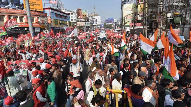 Left parties members and supporters block the Dak Bungalow road during a protest on the 2nd day of 48-hour nationwide general strike called by the central trade unions against alleged anti-worker policies and unilateral labour reforms, in Patna. The two-day strike is to protest the government’s worker policies and rising unemployment among other grievances. (PTI)