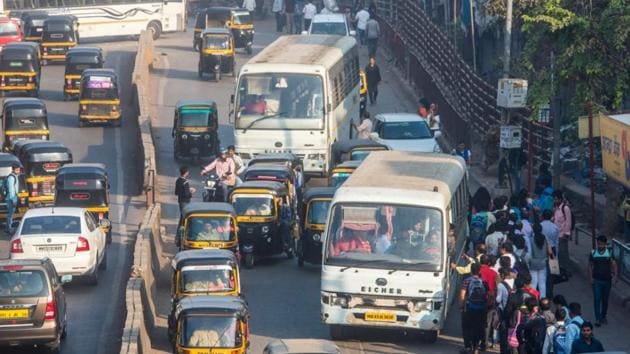 Mumbai: People stand in queue to catch private bus as BEST employees went on a Strike outside Bandra station in Mumbai, India, on Wednesday, January 9, 2019.? (Photo by Pratik Chorge/Hindustan Times)(HT Photo)