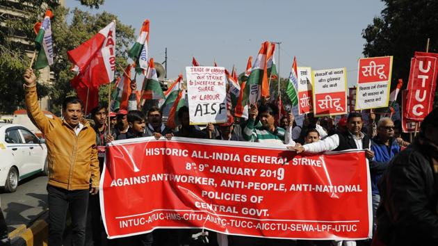 Indian trade union activists shout slogans as they participate in a demonstration on the second day of a two-day nationwide general strike called by various trade unions in New Delhi, India, Wednesday, Jan. 9, 2019. The strike has been called against the government's alleged anti-worker policies and unilateral labour reforms. (AP Photo)(AP)