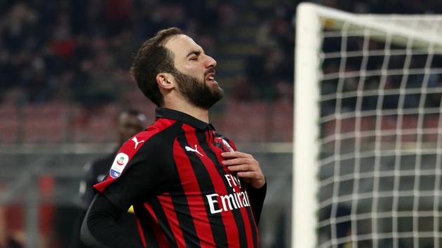 AC Milan's Gonzalo Higuain reacts after a missed chance to score during a Serie A match.(AP)